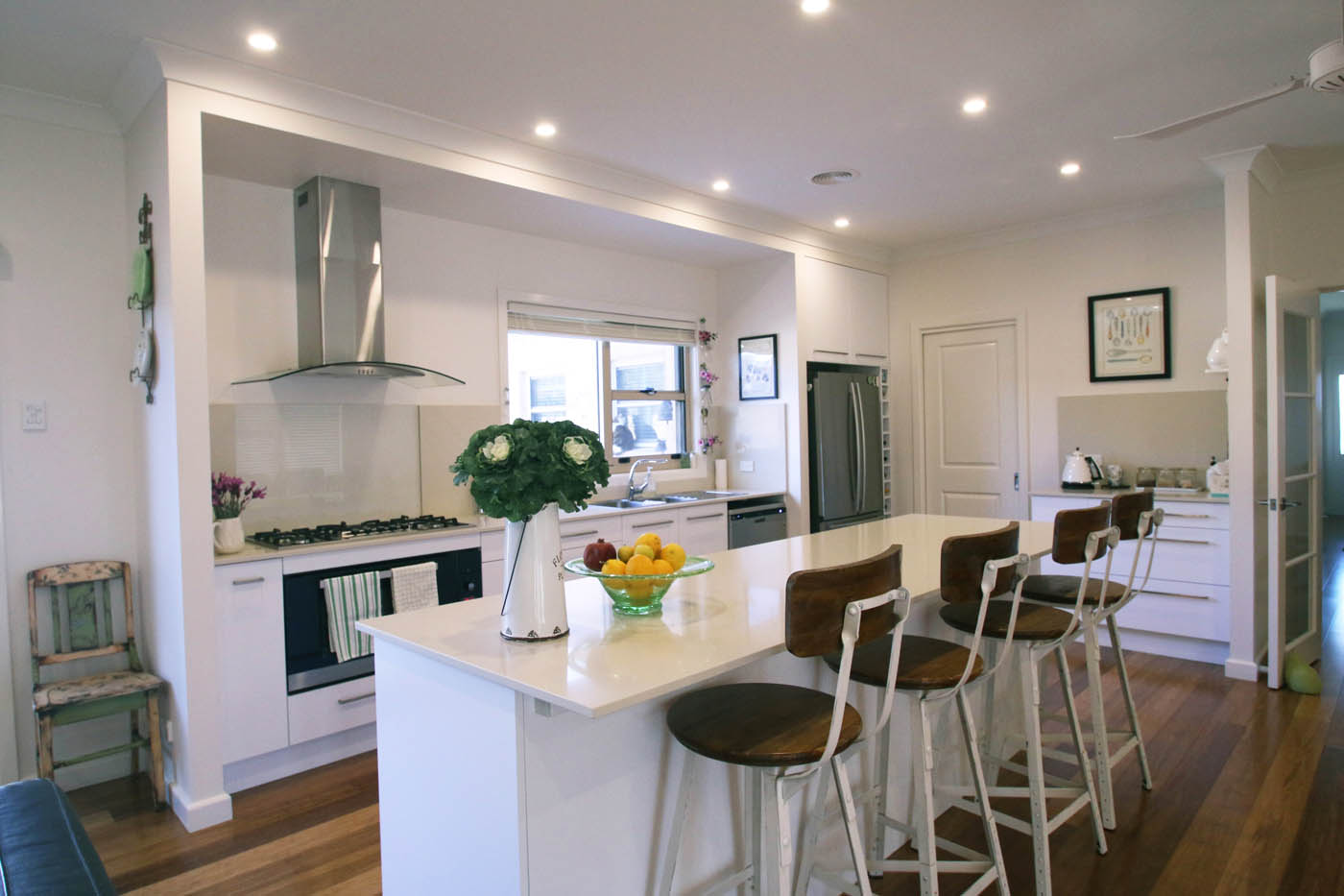 Rustic stools in clean white kitchen